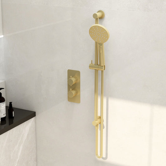 Round slide rail with integrated wall outlet elbow in brushed brass